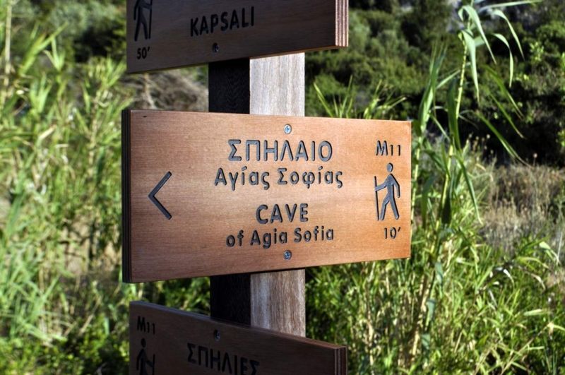 A close-up f a wooden trail sign on the island of Kythera near Agia Sophia cave in Kalamos